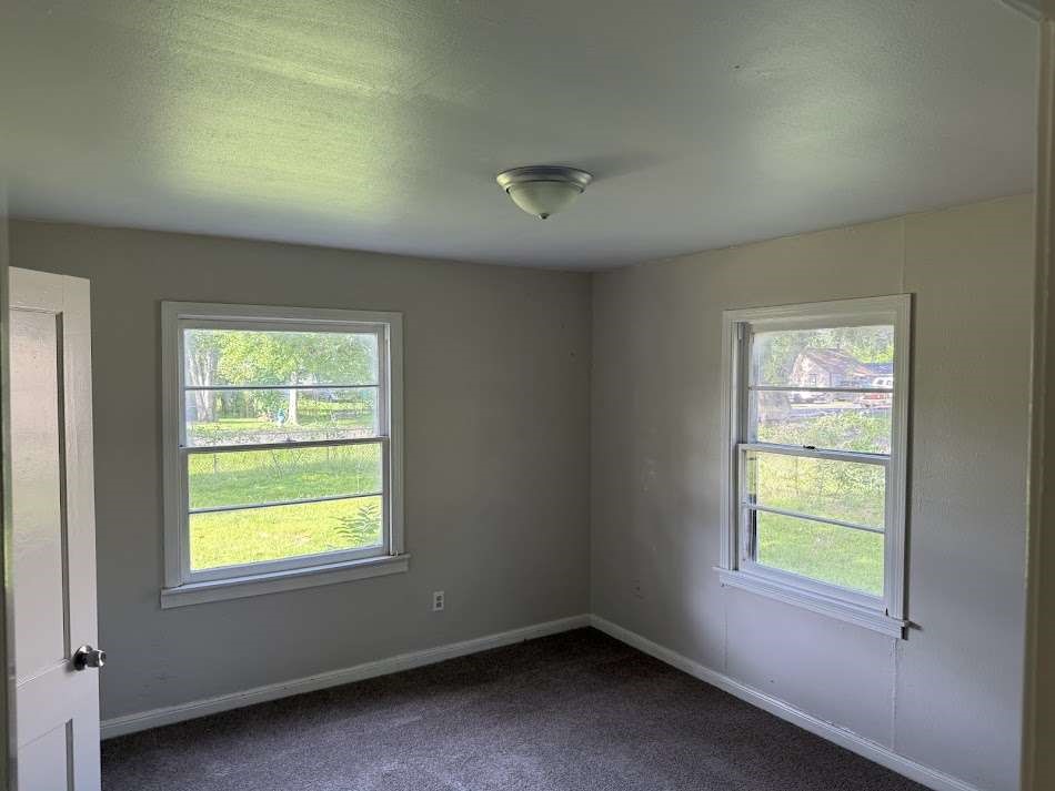 201 Smith Street Clute, TX 77531 - Photo 13 of 22 a view of an empty room with a window