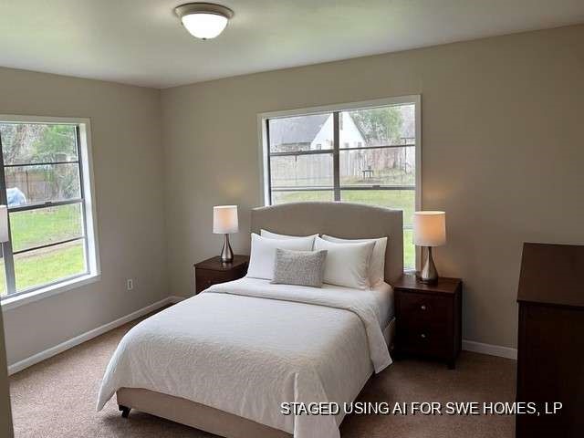 201 Smith Street Clute, TX 77531 - Photo 16 of 22 a bedroom with a bed and a window