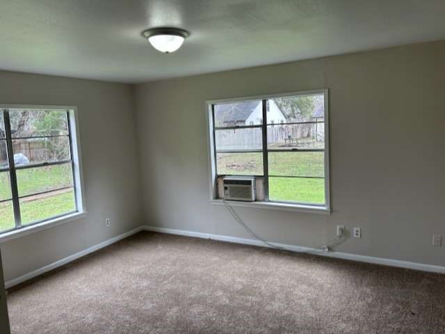 201 Smith Street Clute, TX 77531 - Photo 17 of 22 an empty room with a window