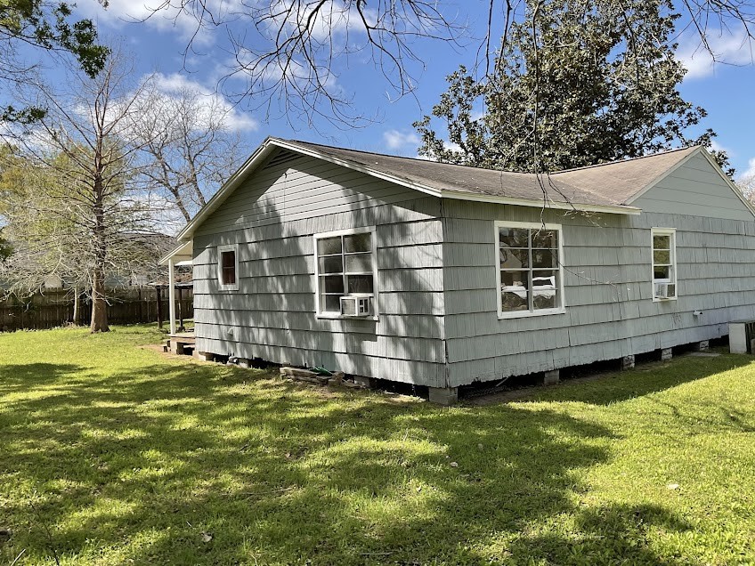 201 Smith Street Clute, TX 77531 - Photo 19 of 22 a view of a house with a yard