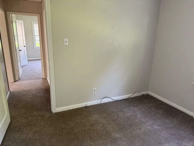 an empty room and a hallway