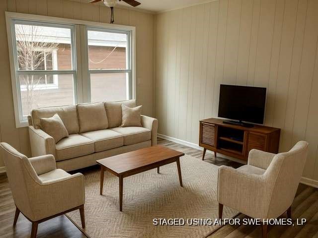 201 Smith Street Clute, TX 77531 - Photo 9 of 22 a living room with furniture and a flat screen tv