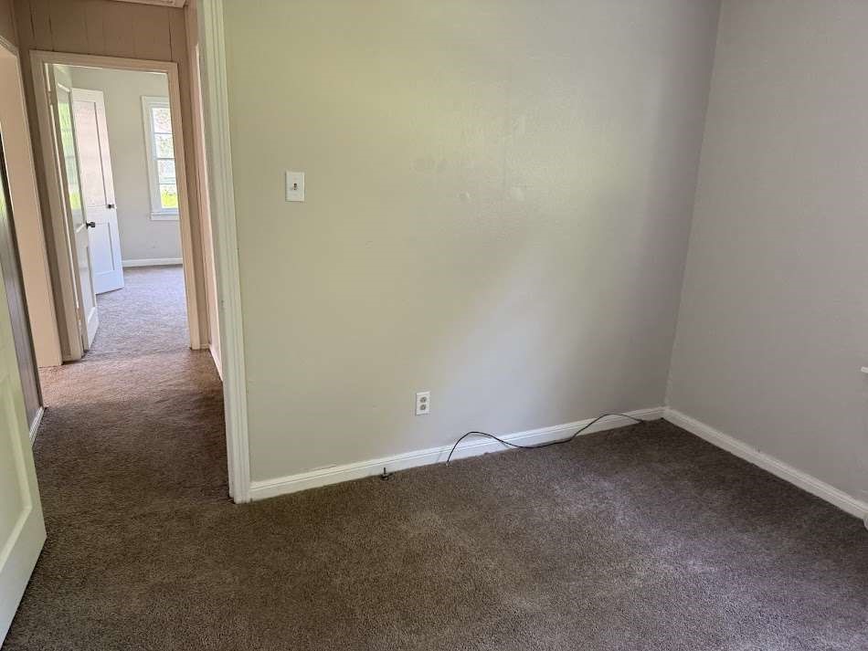 201 Smith Street Clute, TX 77531 - Photo 10 of 22 an empty room and a hallway