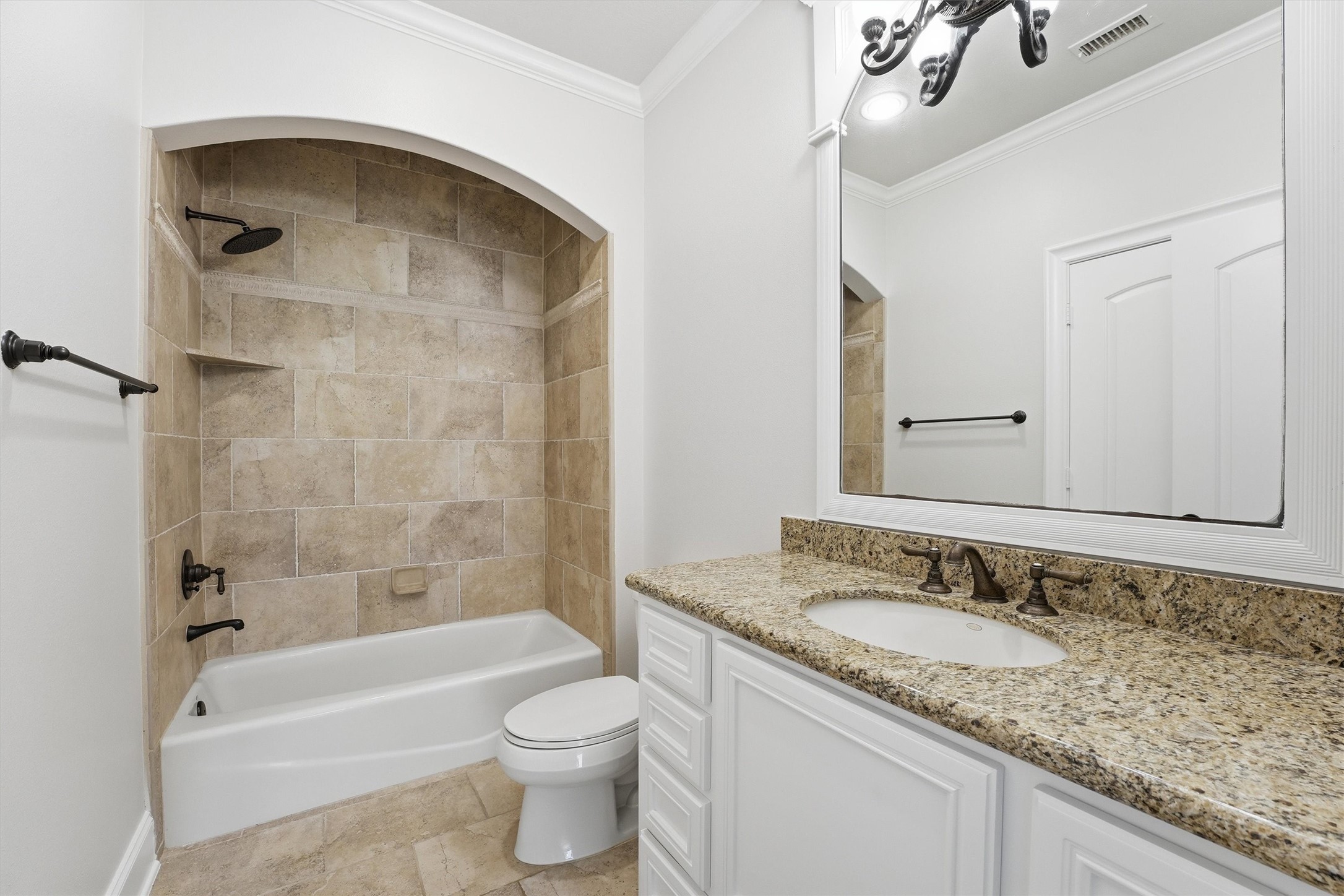 70 Quail Rock Place The Woodlands, TX 77381 - Photo 31 of 46 a bathroom with a granite countertop sink a toilet and bathtub