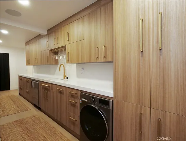 a view of a kitchen with electric appliances