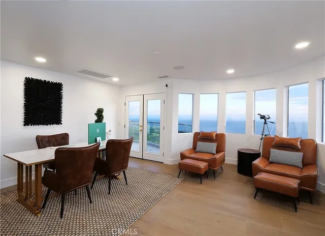 a view of a balcony with chairs