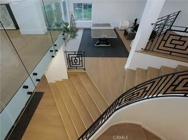 a view of a hallway with dining room and stairs