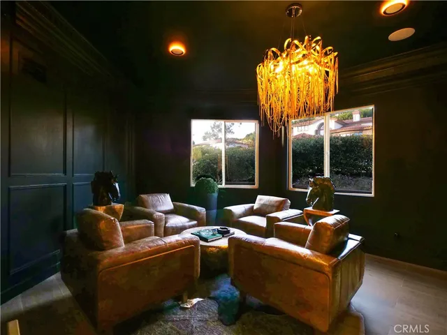 a bedroom with a large bed and a night stand