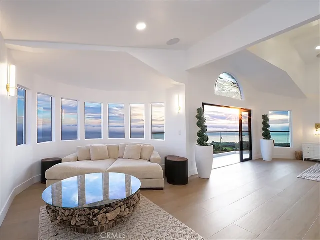 a spacious bathroom with a double vanity sink a mirror and a bathtub