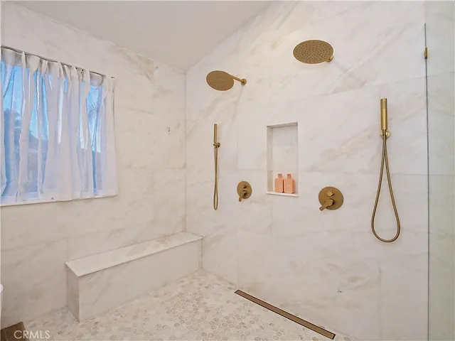 a white bath tub sitting in a bathroom