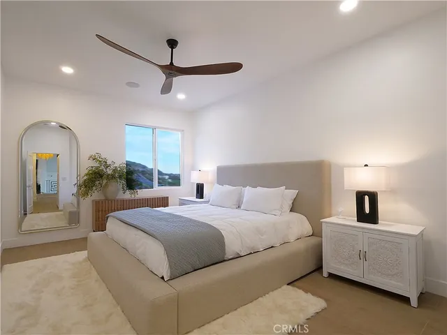 a bedroom with a bed and a dresser