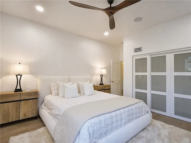 a bathroom with a double vanity sink toilet and shower