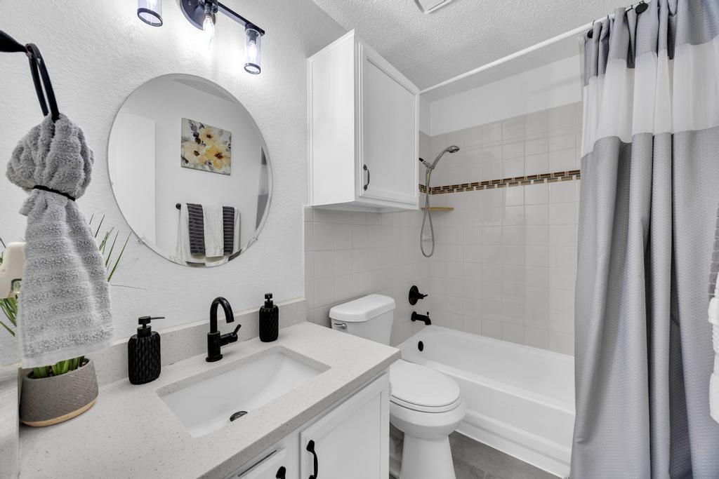 600 Smoke Signal Pass Pflugerville, TX 78660 - Photo 20 of 35 a bathroom with a sink a toilet and a mirror