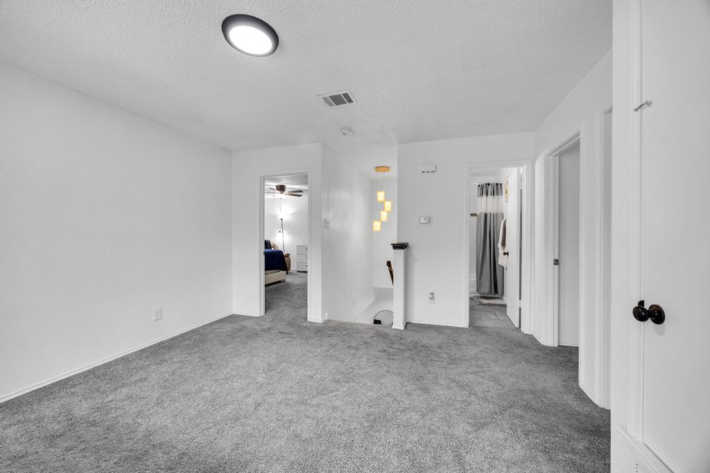 600 Smoke Signal Pass Pflugerville, TX 78660 - Photo 22 of 35 a view of a livingroom with a chandelier