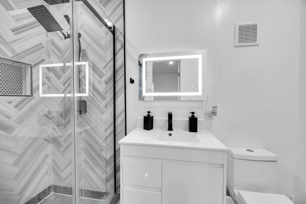 600 Smoke Signal Pass Pflugerville, TX 78660 - Photo 30 of 35 a bathroom with a sink and mirror with toilet