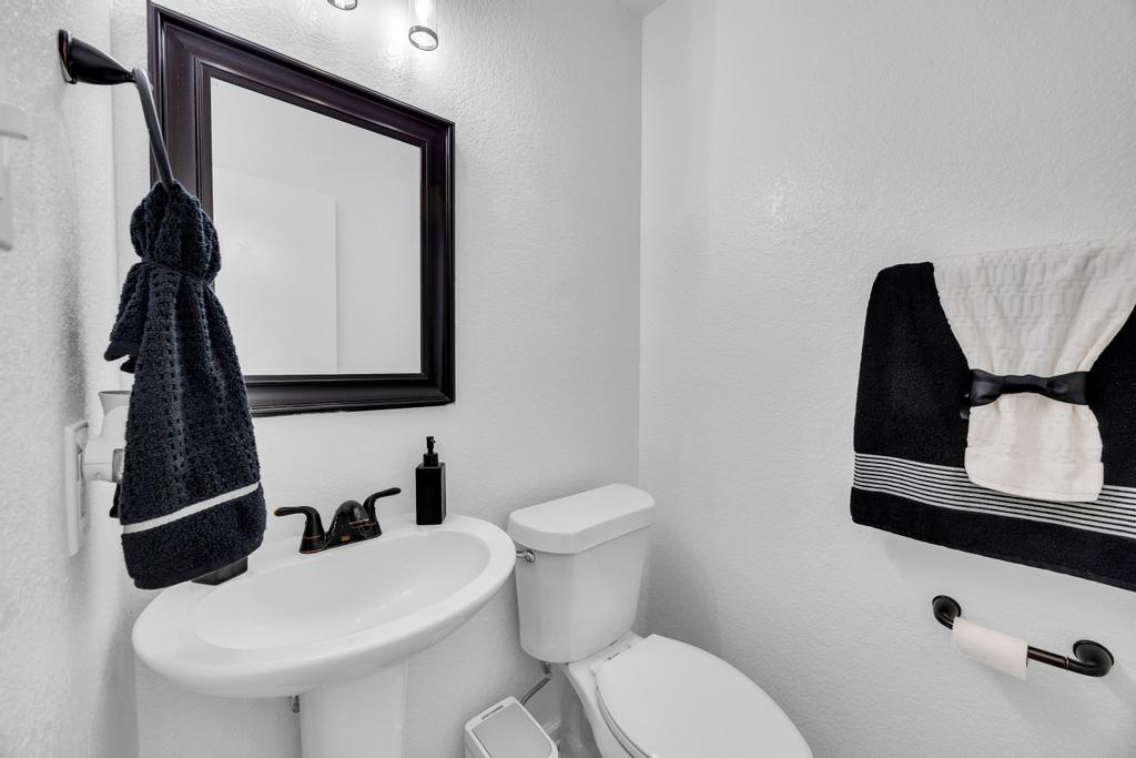 600 Smoke Signal Pass Pflugerville, TX 78660 - Photo 9 of 35 a bathroom with a toilet sink and mirror