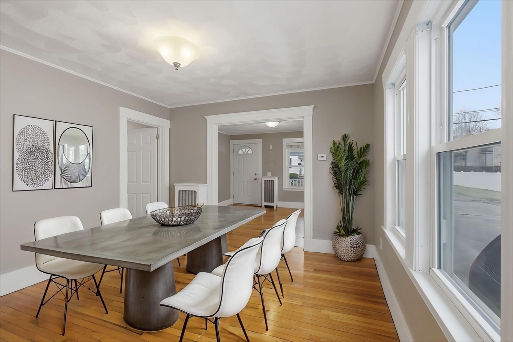 12 Riverside Court Saugus, MA 01906 - Photo 13 of 39 a view of a dining room with furniture and wooden floor