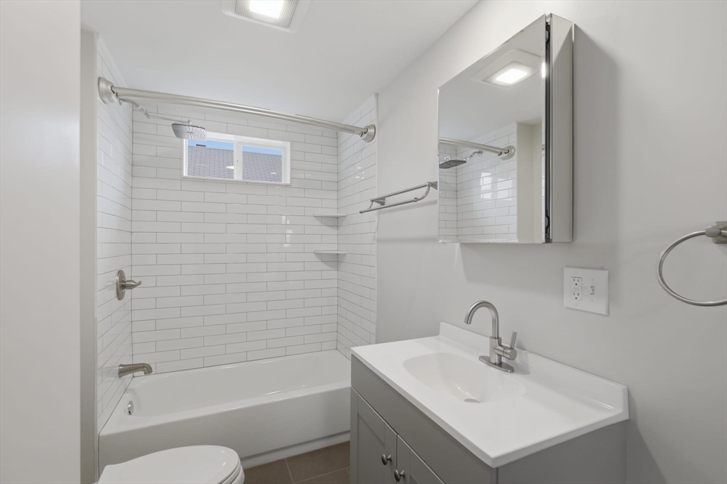 12 Riverside Court Saugus, MA 01906 - Photo 23 of 39 a bathroom with a sink toilet and shower