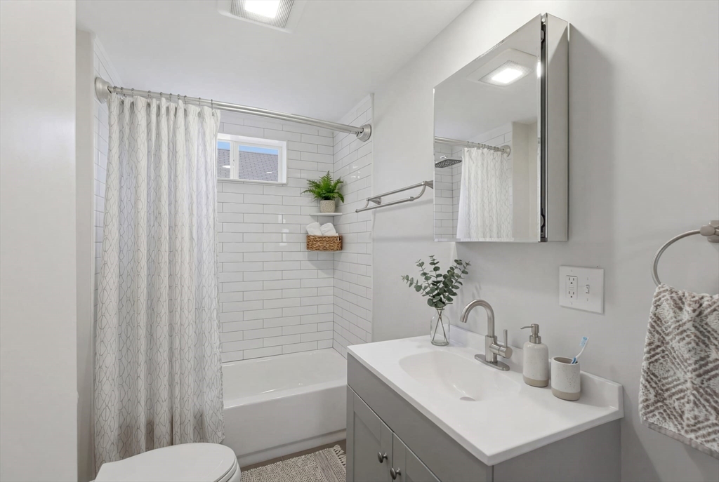 12 Riverside Court Saugus, MA 01906 - Photo 24 of 39 a bathroom with a sink toilet and shower