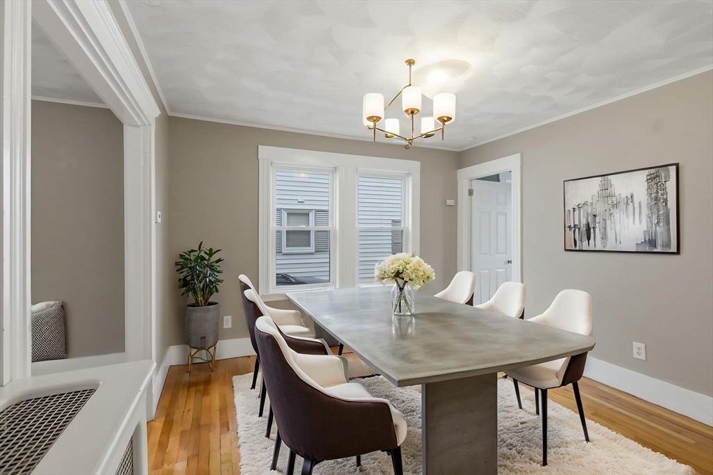 12 Riverside Court Saugus, MA 01906 - Photo 26 of 39 a view of a dining room with furniture and chandelier