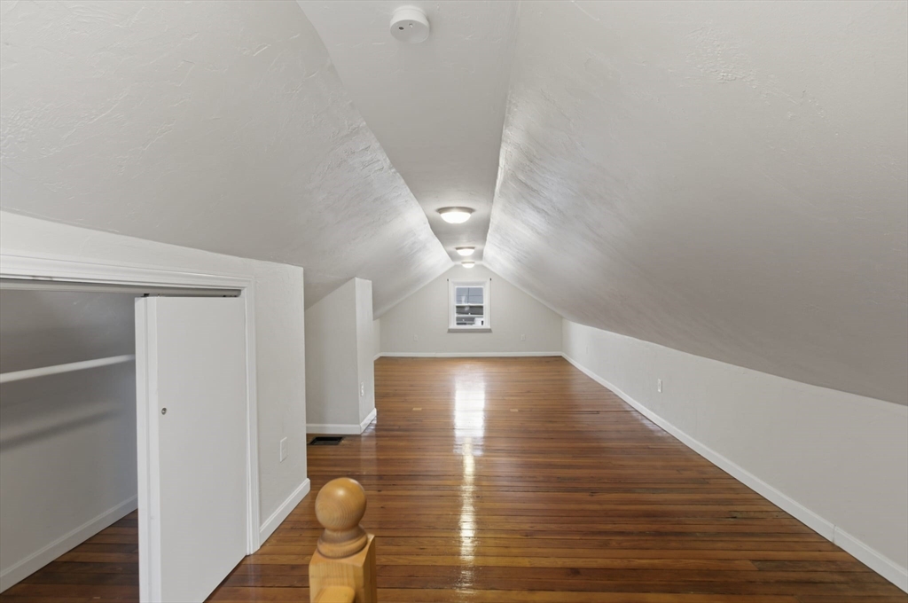 12 Riverside Court Saugus, MA 01906 - Photo 34 of 39 a view of an empty room with wooden floor and a window