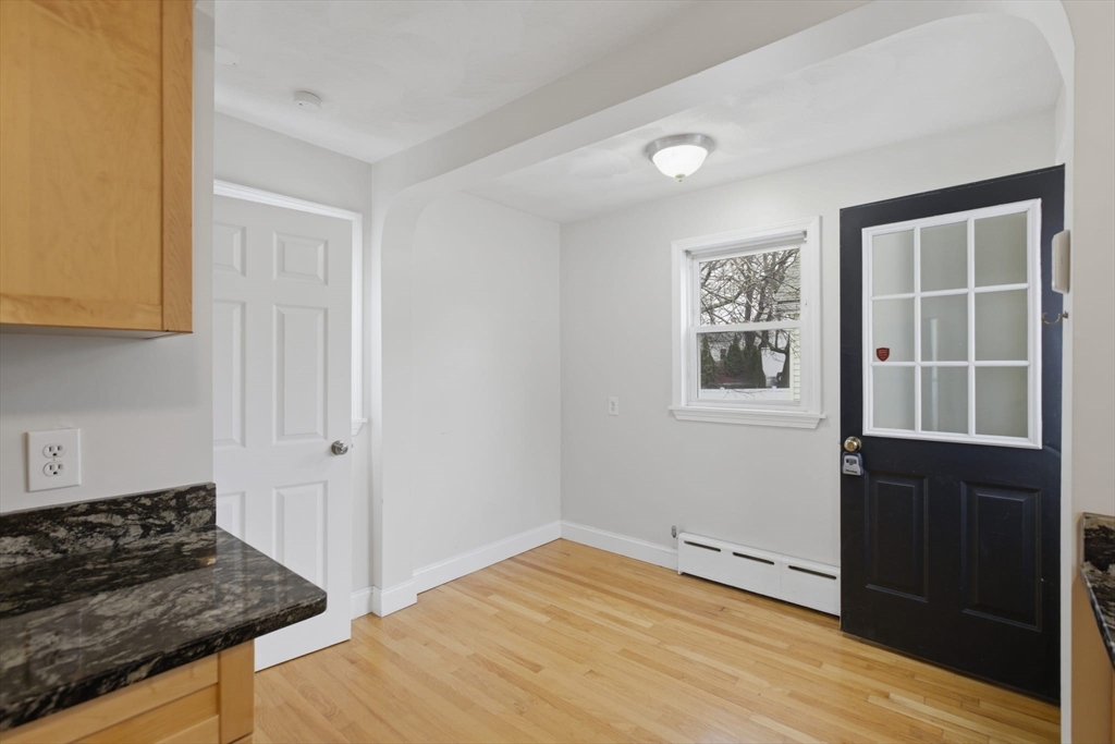 12 Riverside Court Saugus, MA 01906 - Photo 7 of 39 a view of a kitchen with wooden floor and a sink
