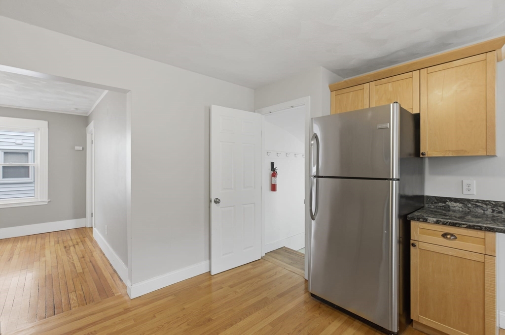 12 Riverside Court Saugus, MA 01906 - Photo 9 of 39 a view of kitchen with wooden floor and electronic appliances