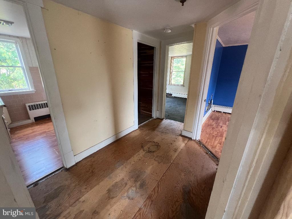 13813 Maple Tree Lane Southwest Cumberland, MD 21502 - Photo 19 of 26 a bedroom with a bed and a window
