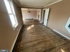 a view of an empty room and a window