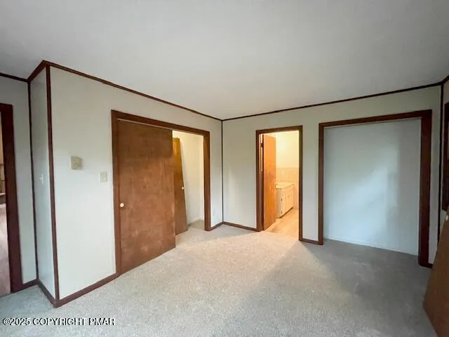 a view of empty room with windows