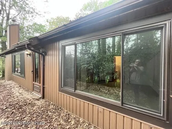 a view of a glass door and a yard