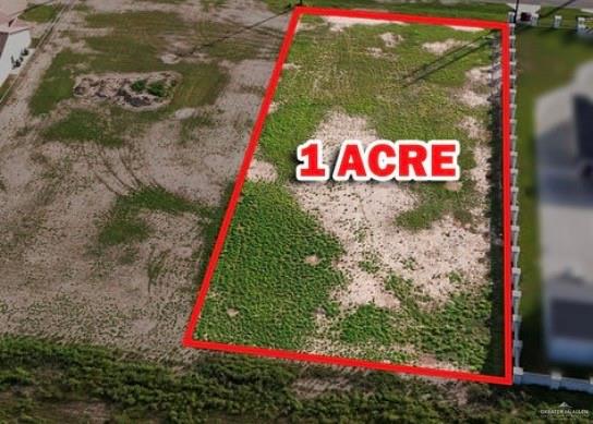 2911 East Alberta Road Edinburg, TX 78542 - Photo 3 of 8 a sign that is sitting on a brick wall