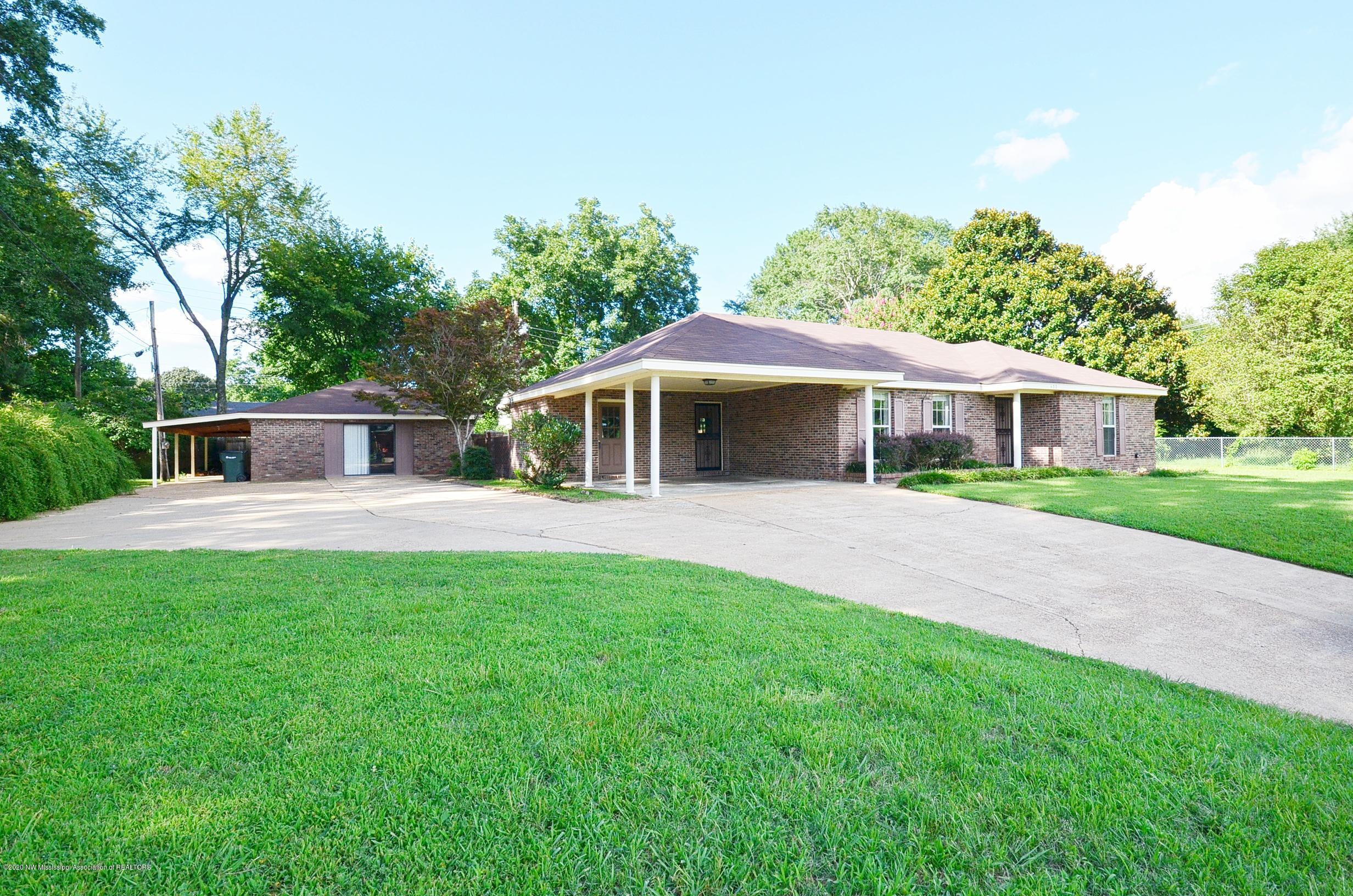 Front of home and pool house