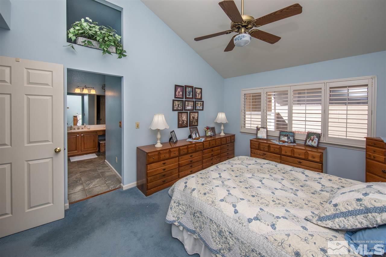 3345 Blackstone Court Reno, NV 89509 - Photo 16 of 29 a bedroom with a large bed and a window