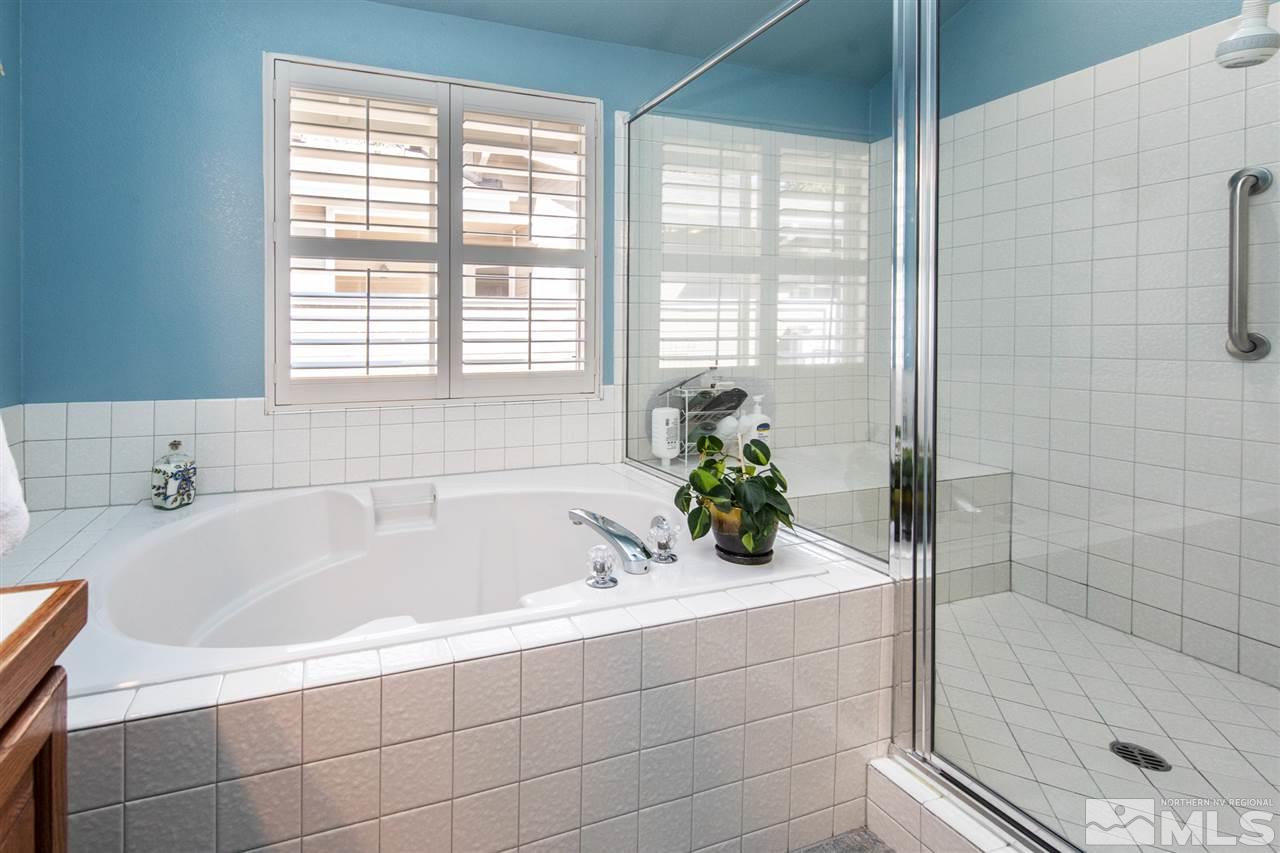 3345 Blackstone Court Reno, NV 89509 - Photo 18 of 29 a bathroom with a bathtub and shower