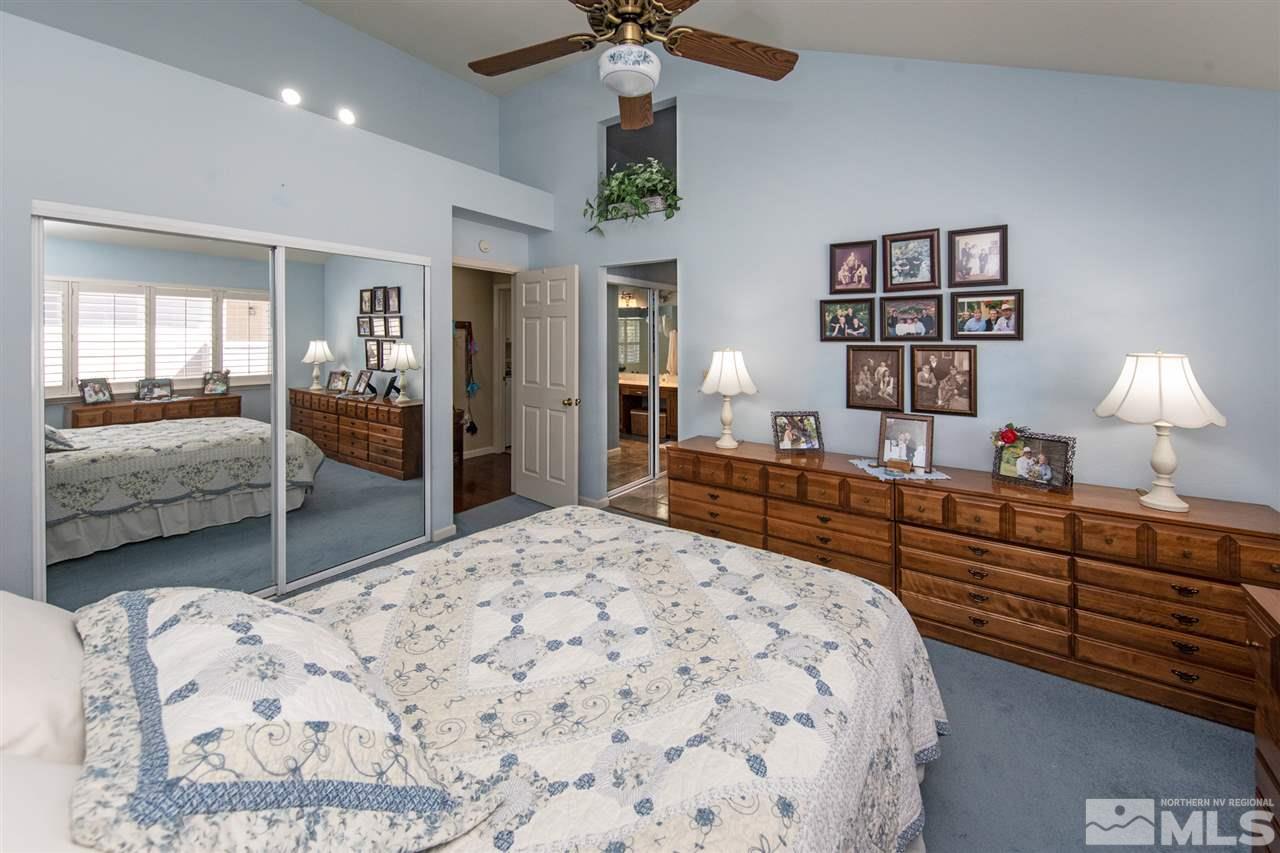 3345 Blackstone Court Reno, NV 89509 - Photo 19 of 29 a bed room with a bed and a dresser