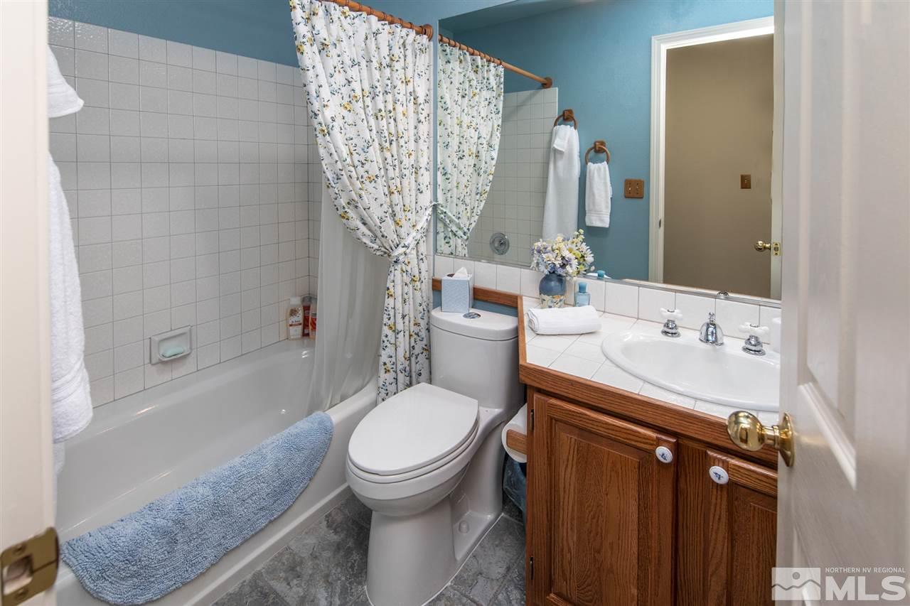 3345 Blackstone Court Reno, NV 89509 - Photo 22 of 29 a bathroom with a sink toilet and shower