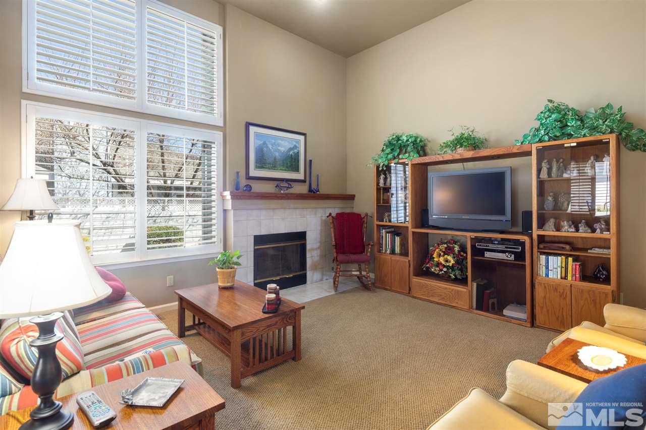 3345 Blackstone Court Reno, NV 89509 - Photo 7 of 29 a living room with furniture and a flat screen tv