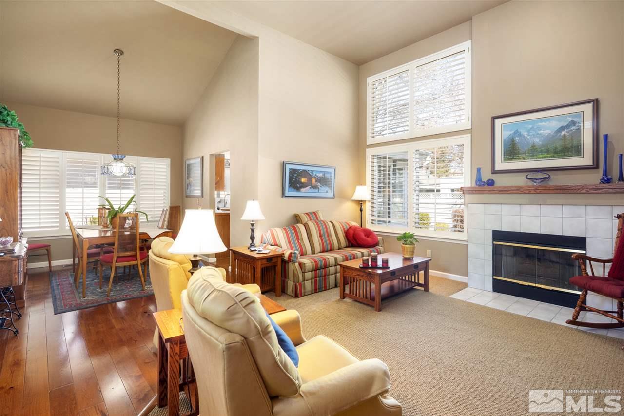 3345 Blackstone Court Reno, NV 89509 - Photo 8 of 29 a living room with furniture large window and a fireplace