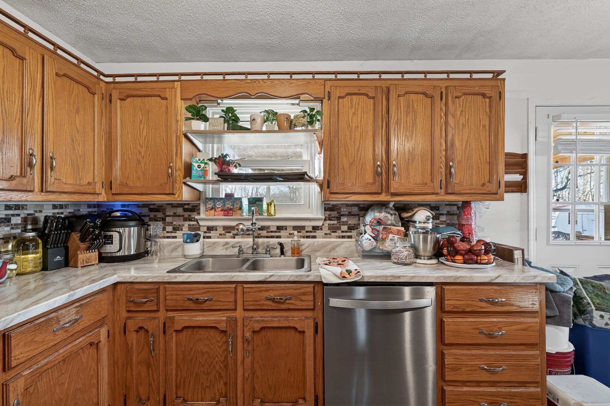 103 Reaves Cove Road Columbia, TN 38401 - Photo 15 of 24 a kitchen with stainless steel appliances granite countertop a sink stove and cabinets