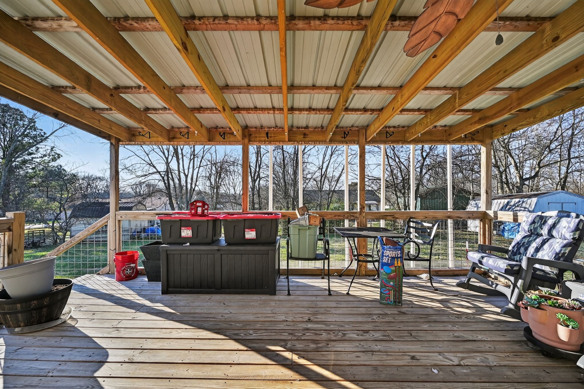 103 Reaves Cove Road Columbia, TN 38401 - Photo 6 of 24 a view of a patio with table and chairs potted plants with wooden floor