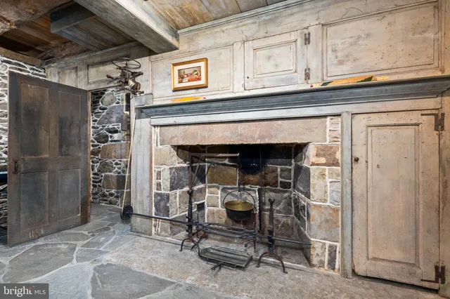 a stove top oven sitting inside of a kitchen