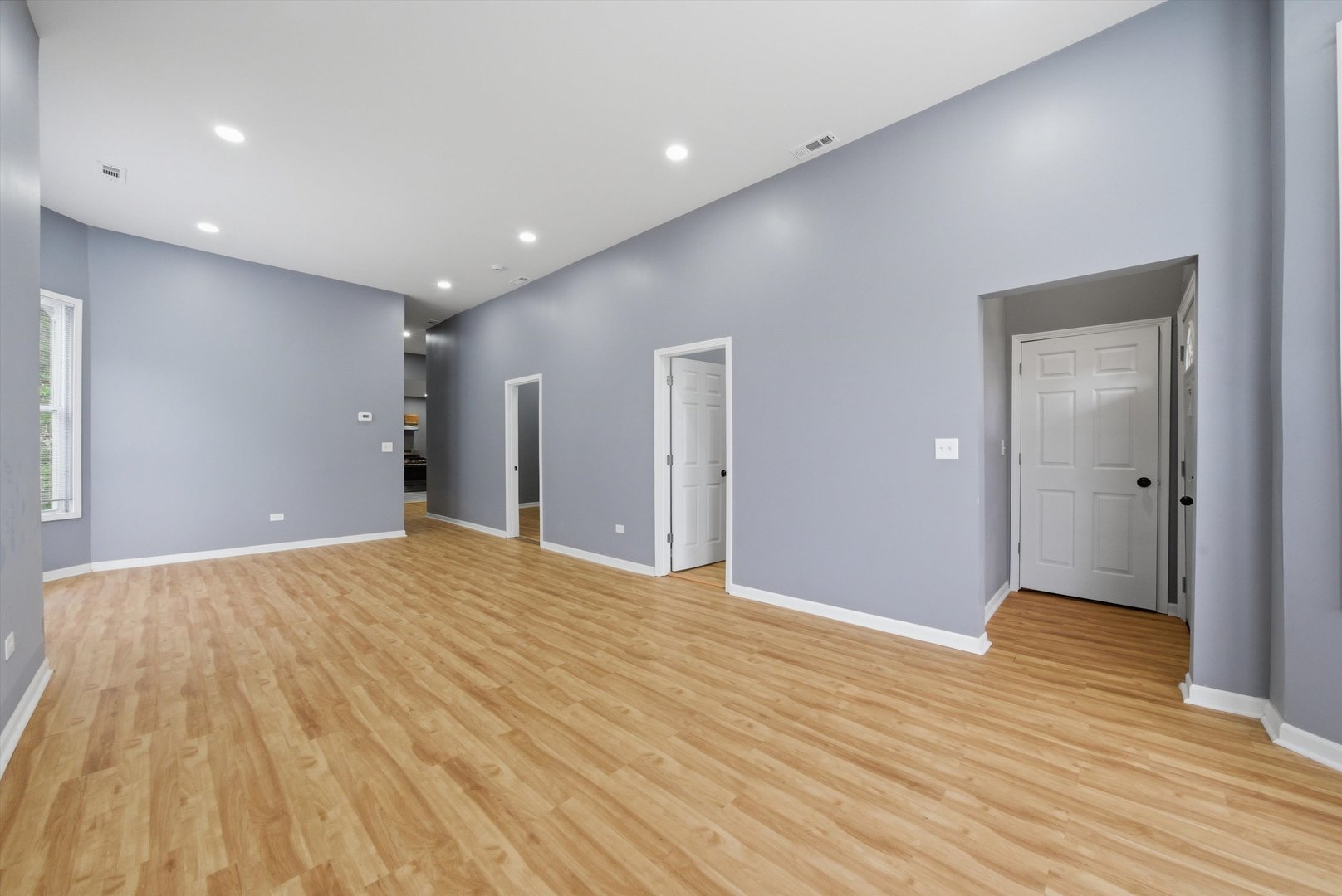 7828 South Escanaba Avenue Chicago, IL 60649 - Photo 6 of 41 a view of an empty room with wooden floor