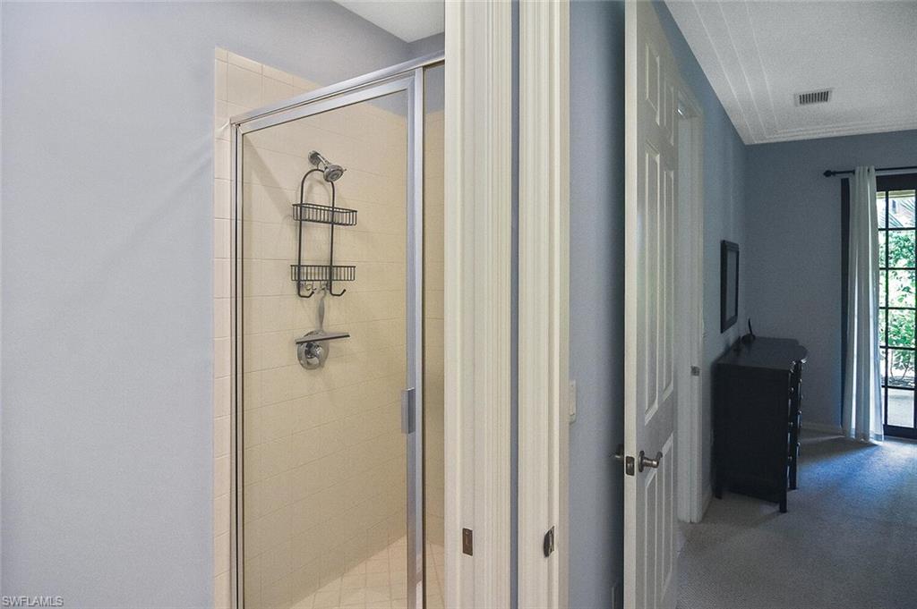8949 Malibu Street, Unit 303 Naples, FL 34113 - Photo 13 of 50 a view of a hallway with closet and front door