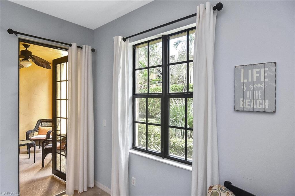 8949 Malibu Street, Unit 303 Naples, FL 34113 - Photo 33 of 50 a view of a room that has a bed and a window