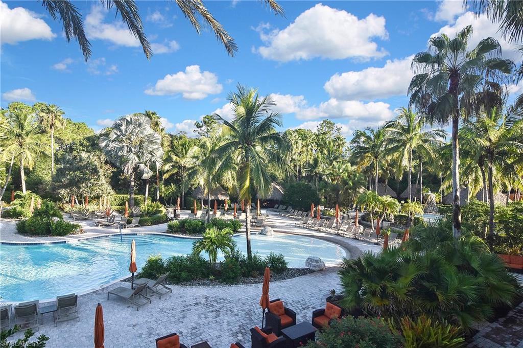 8949 Malibu Street, Unit 303 Naples, FL 34113 - Photo 42 of 50 a view of a yard with plants and trees