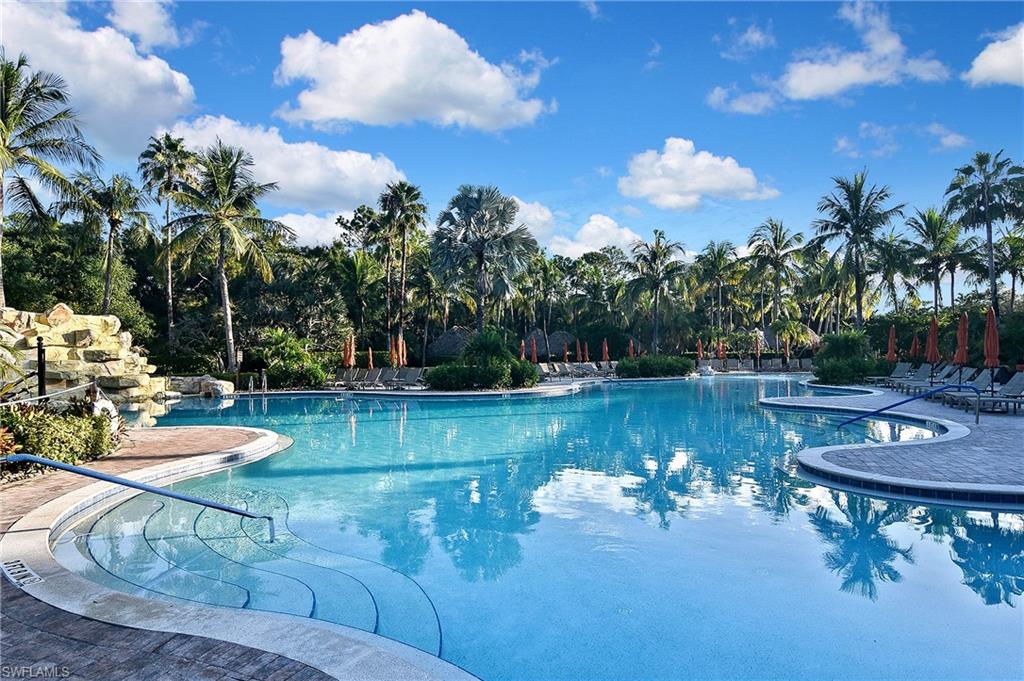 8949 Malibu Street, Unit 303 Naples, FL 34113 - Photo 45 of 50 a view of a swimming pool with a patio and a yard