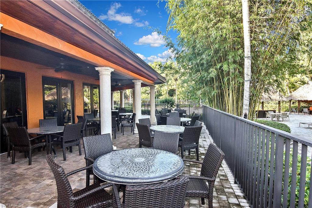 8949 Malibu Street, Unit 303 Naples, FL 34113 - Photo 49 of 50 a view of a patio with couches table and chairs