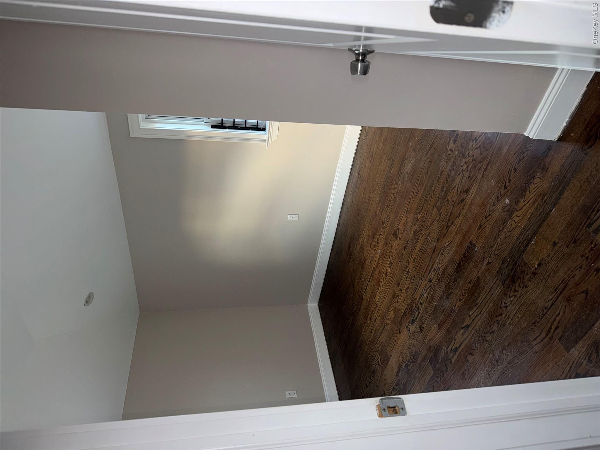 13916 Caney Lane, Unit 2 Queens, NY 11422 - Photo 7 of 9 wooden floor in an empty room