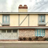 a front view of a house with garage